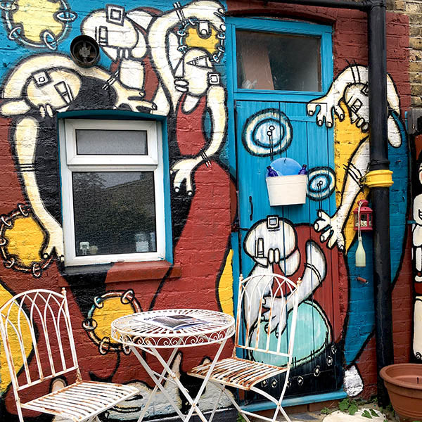 Dancing Ladies garden mural painting by ATADesigns — hand-painted with outdoor paint and Montana Gold spray paint