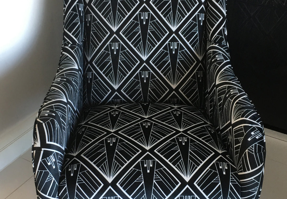 Close up of single Art Deco arm chair featuring geometric black and white design by ATADesigns