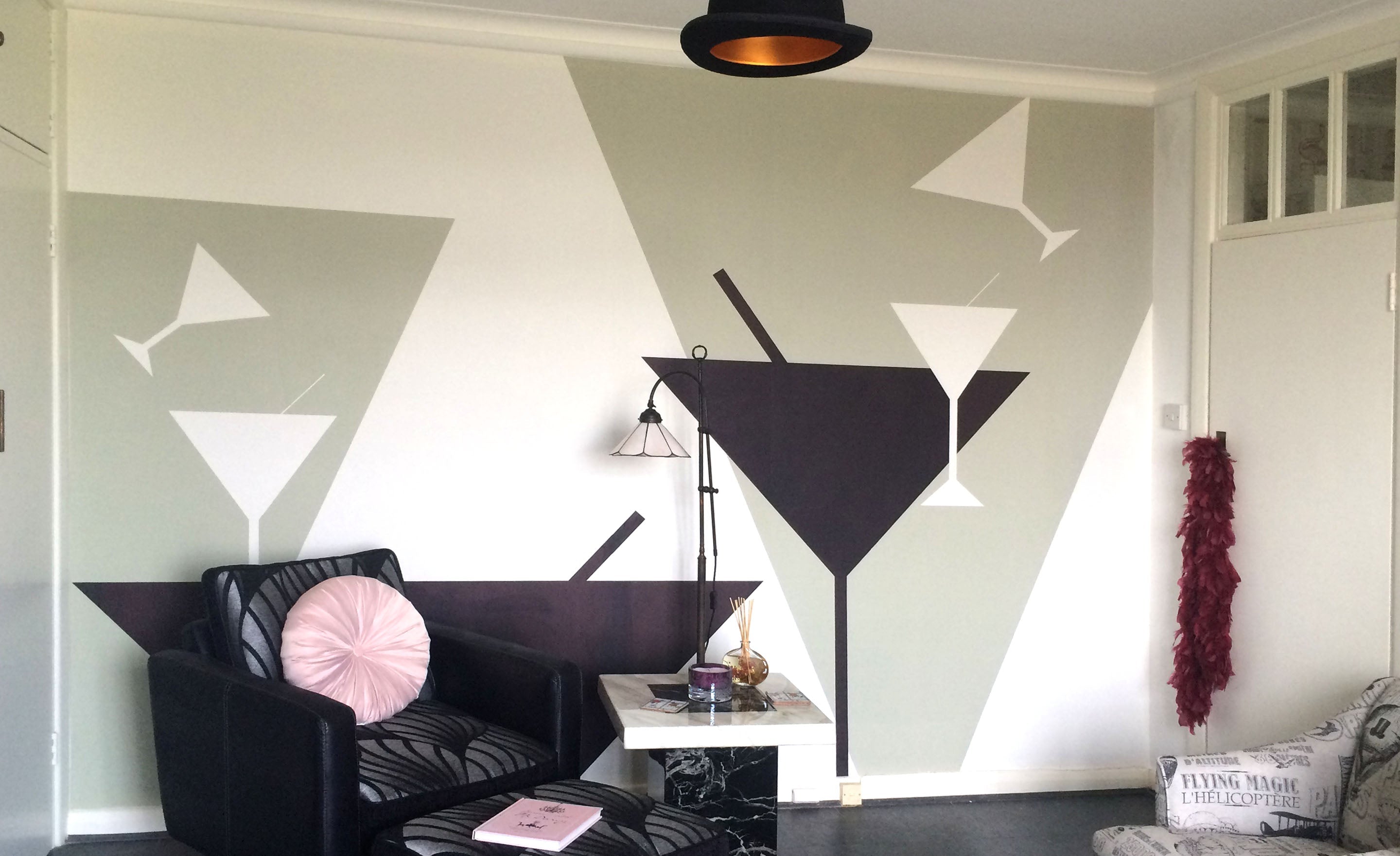 Tipsy Art Deco Mural by ATADesigns featuring cocktail black and white cocktail glasses on light grey and white background in lounge