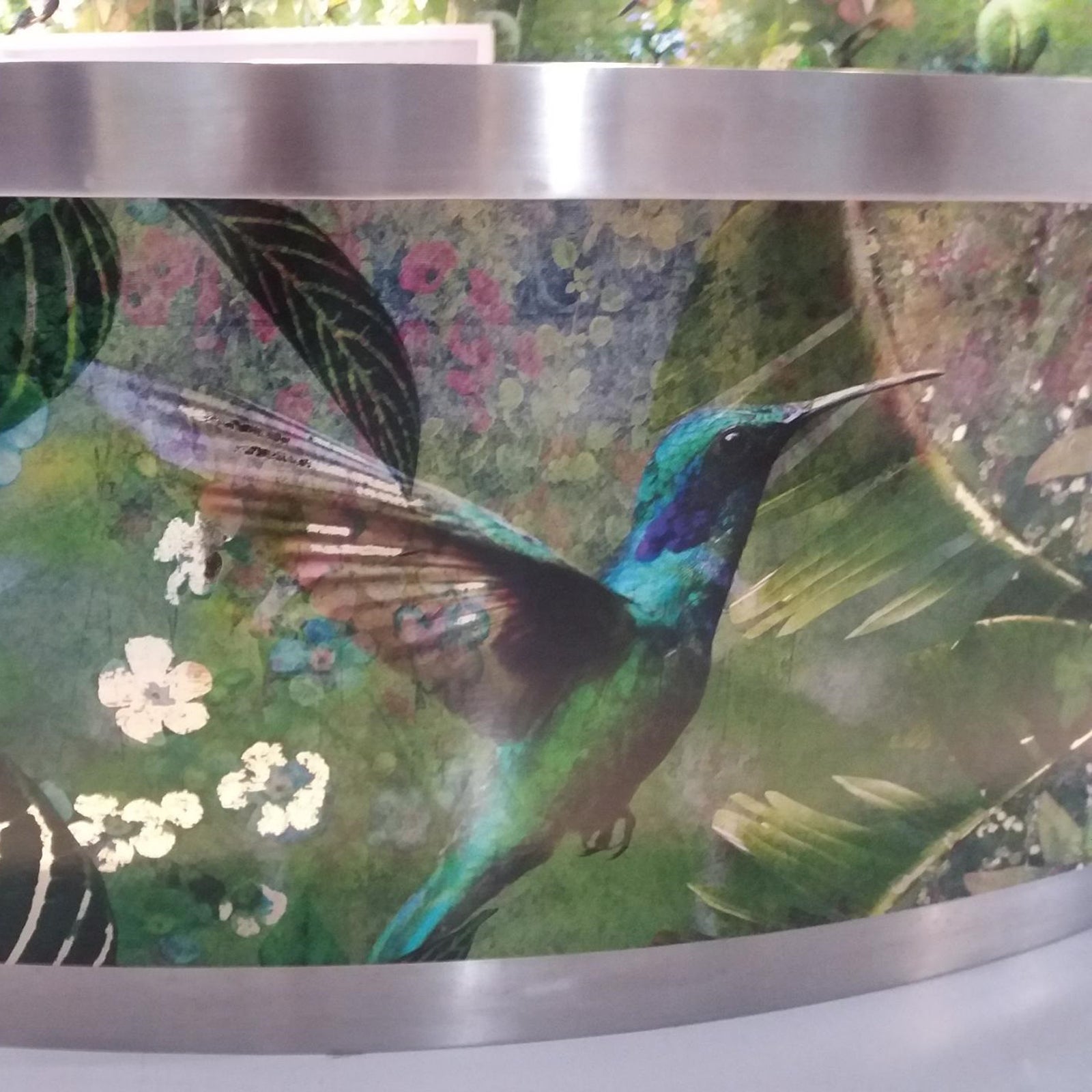 Nature Springs to Live mural design by ATADesigns feature large humming bird, flowers, leaves on green textured background