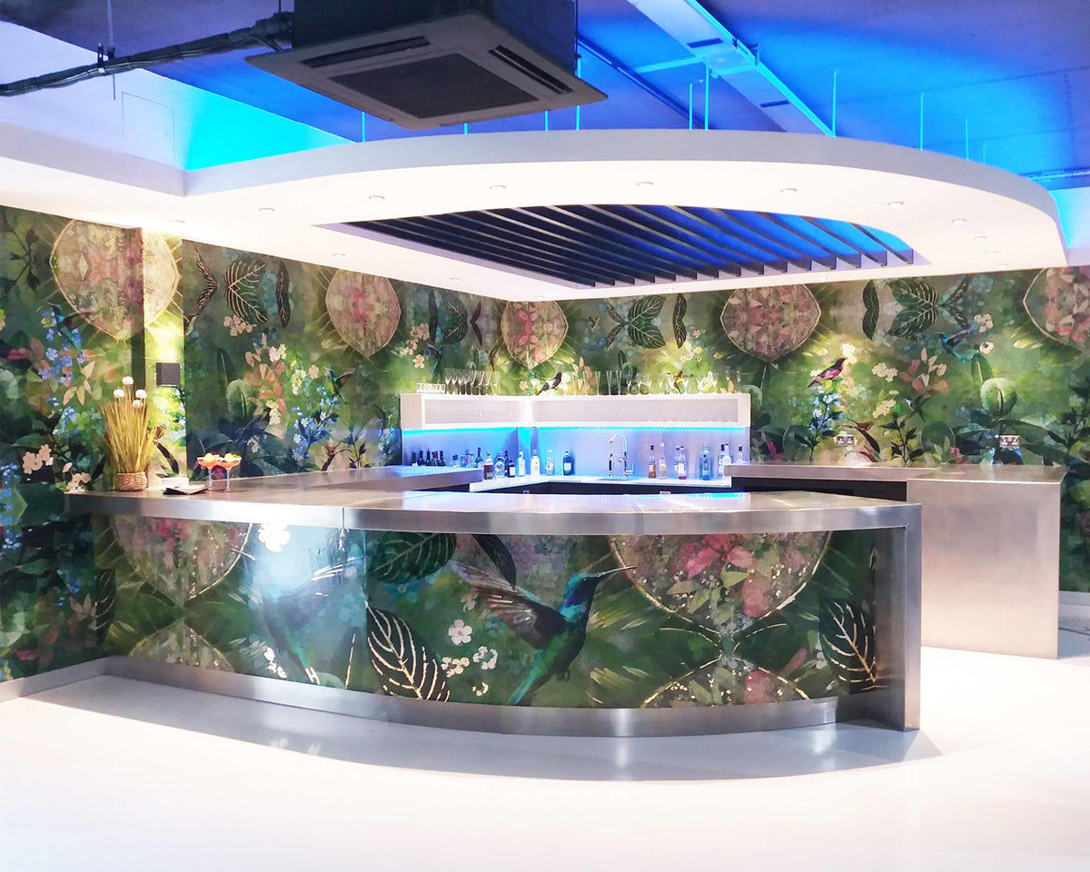 A Modern bar with floral wallpaper and stainless steel appliances.  Wallpaper design by AtTADesigns for Papergraphics.