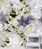 Among Angels Abstract floral mural by ATADesigns.  Featuring angels sitting among stylized lotus flowers, leaves, and soft brushstrokes in gray, white, black, and muted gold, shown with a white stool in front of it.
