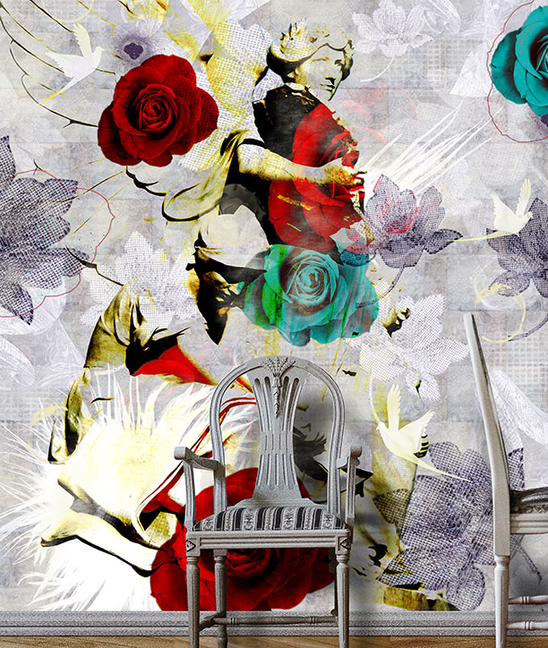 A large wall mural Angels Among Roses featuring an abstract collage of red and teal roses, a classical angels, and white birds on a textured light grey background, shown in a room setting behind a white wooden chair. Mural design by ATADesigns.