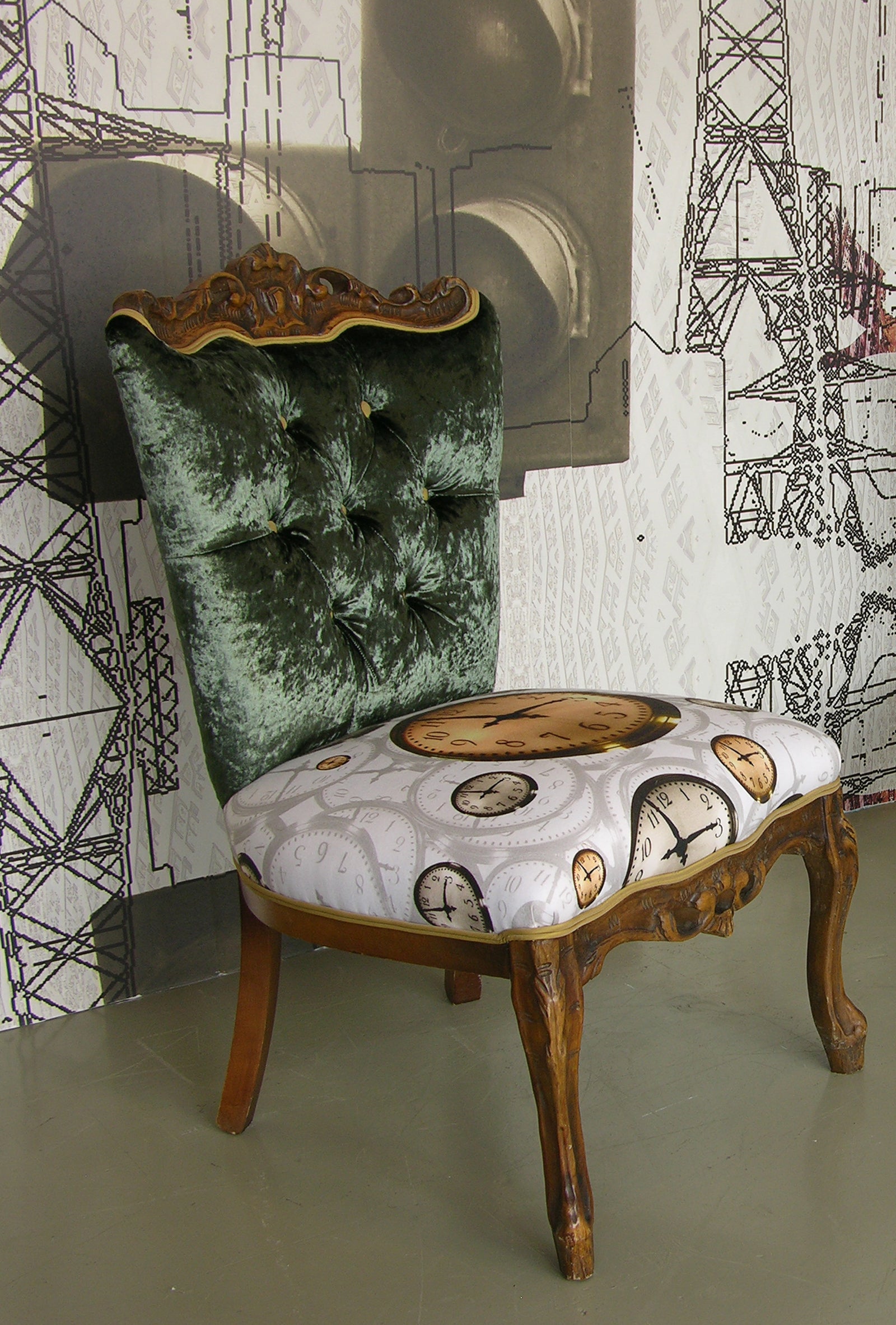 Close up of Nursing Chair upholstered with floating clocks fabric design on seating by ATADesigns and green velvet fabric on back of chair, in front of large mural featuring traffic lights - mural design by ATADesigns.  Chair upholstered by Urban Upholstery.  A collaboration project.