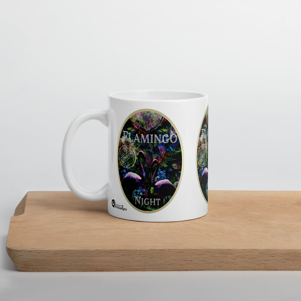 Flamingo Night mug with pink flamingos and colourful botanical artwork, displayed on a wooden board.