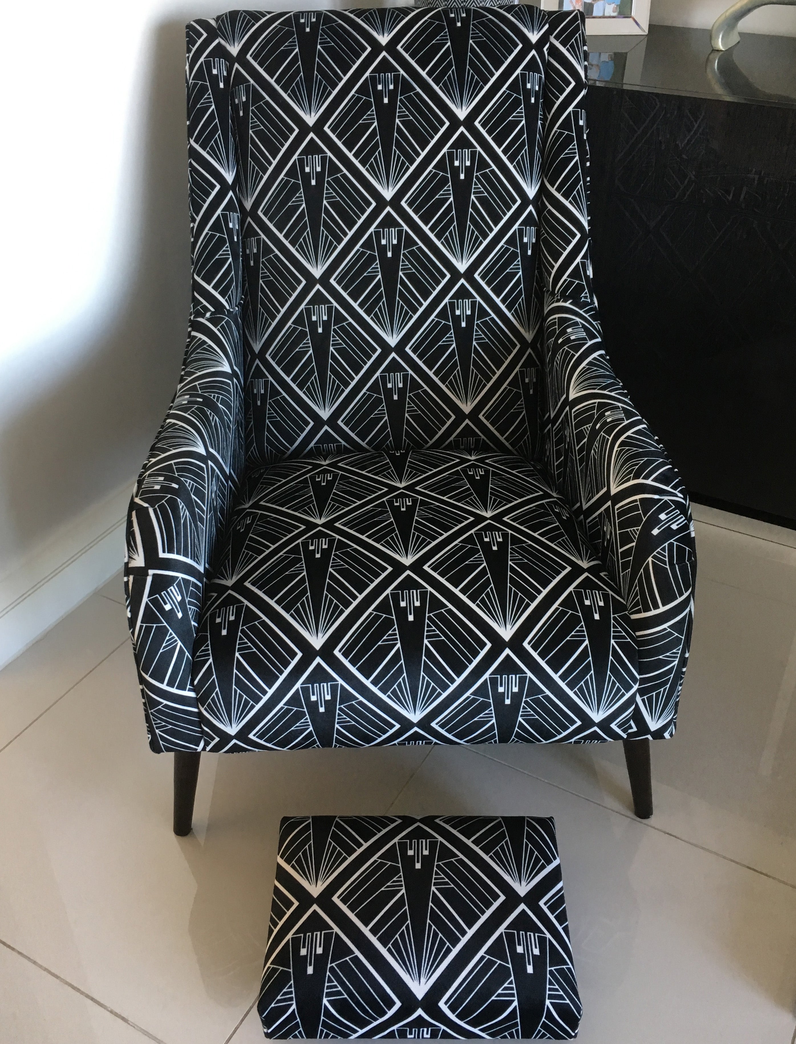Chair upholstered with geometric art deco fabric design by ATADesigns