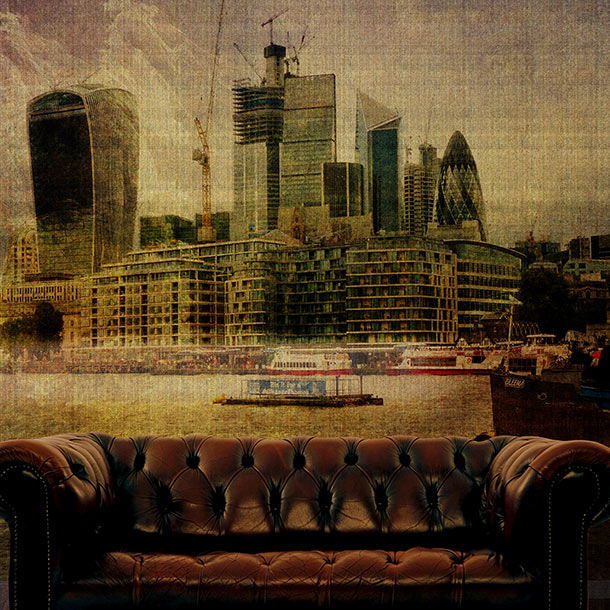 A brown leather tufted sofa in the foreground with a sepia-toned London city skyline and water scene by ATADesigns behind it, creating a surreal staged interior look.