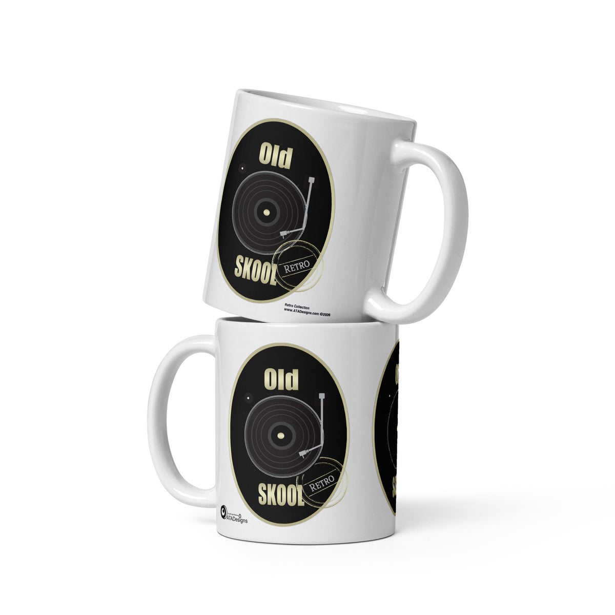 Two stacked white Old Skool Black Design mugs by ATADesigns, each showing a black vinyl record and cream lettering.