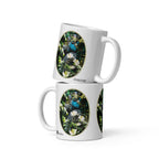 Two stacked Peacock Glam mugs by ATADesigns, each showing a peacock among green foliage and white flowers.