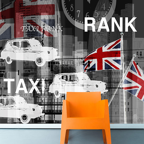Taxi Rank London mural design by ATADesigns featuring illustration of English taxis in white with Union Jack flags and a giant clock on grey overlayed background.  Taxi Rank text in large writing is also in the mural.  An orange chair is positioned in front of the mural.