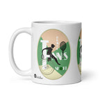 White Tennis Deuce mug with a black tennis-player silhouette, rackets and white lettering on green, handle on the left.