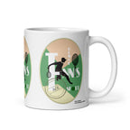 White Tennis Deuce mug with a black tennis-player silhouette, rackets and white lettering on green, handle on the right.