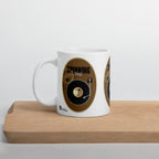 Vinyl Retro mug with black record artwork on a brown background, displayed on a wooden board.